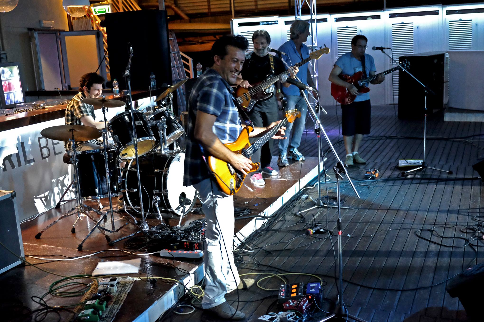 Matteo Greco playing drums with his bandmates