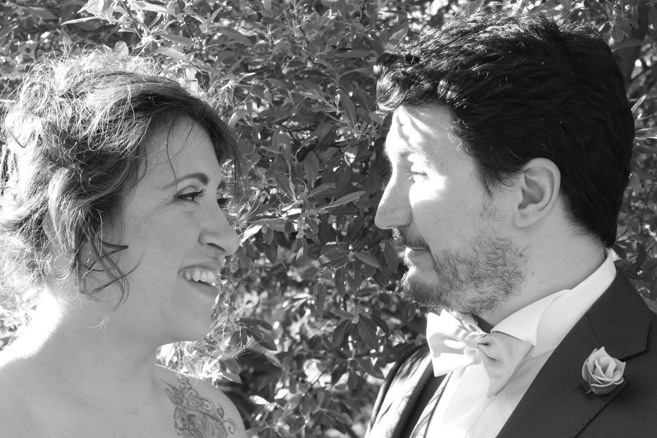 Matteo Greco and wife smiling at their wedding